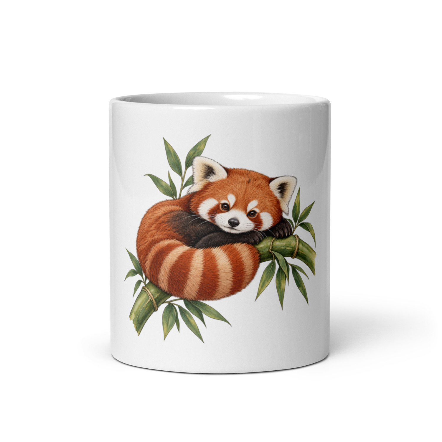 White ceramic mug showing a curled red panda among bamboo leaves; close view of the printed illustration