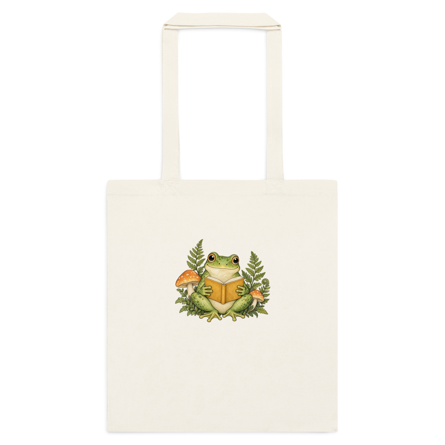 Natural cotton tote with a green frog reading a book among ferns and mushrooms