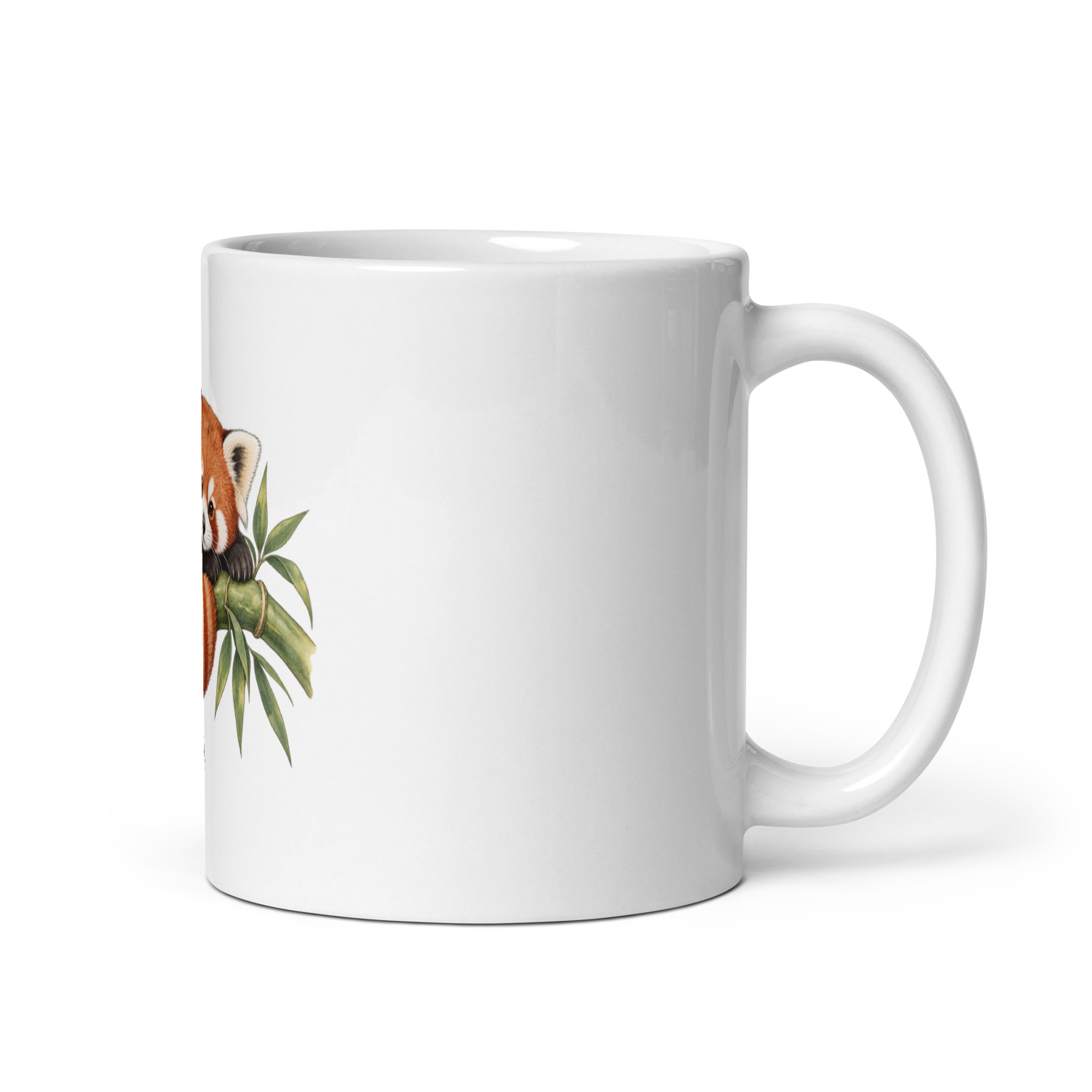 White ceramic mug showing a curled red panda among bamboo leaves; full mug and handle view
